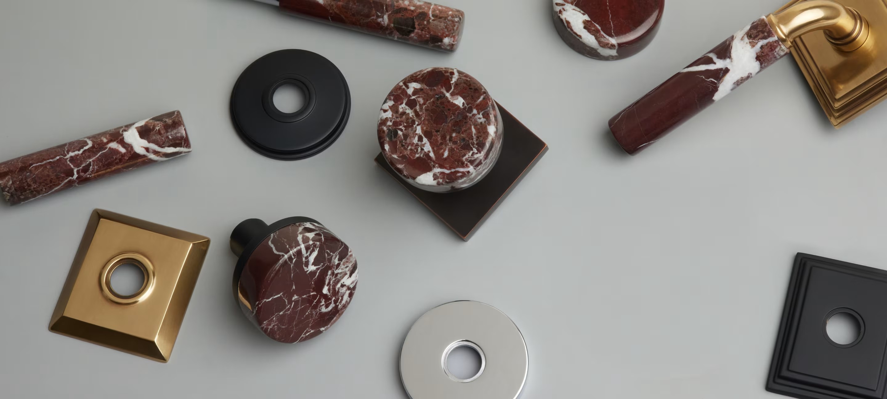 Emtek stone and metal cabinet knobs and levers in mixed finishes