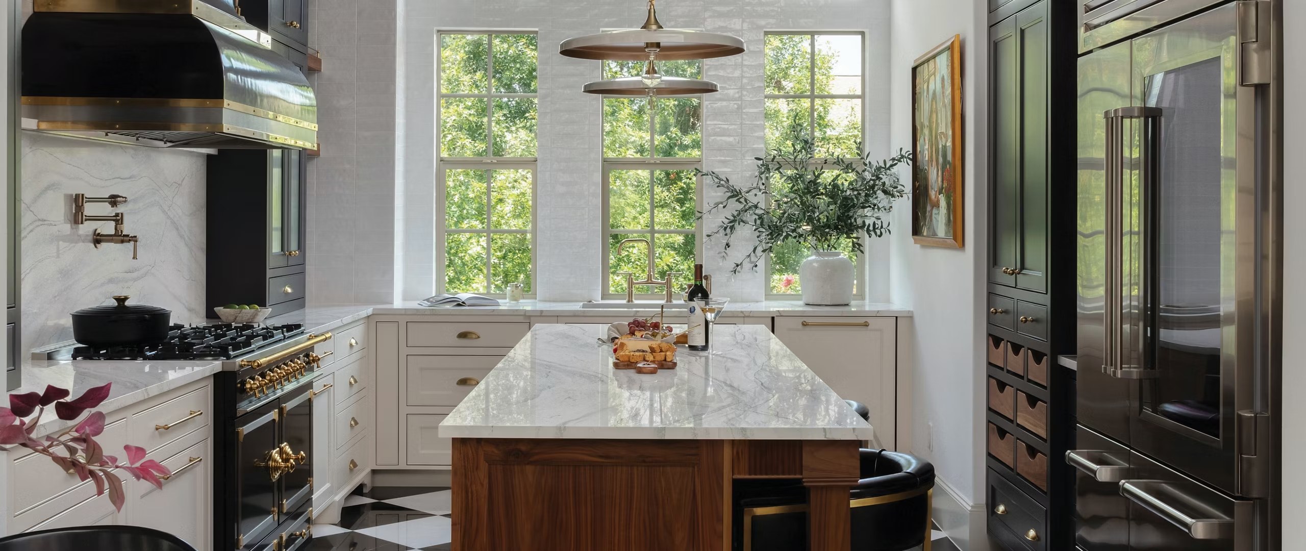 Custom kitchen with cabinetry and marble island